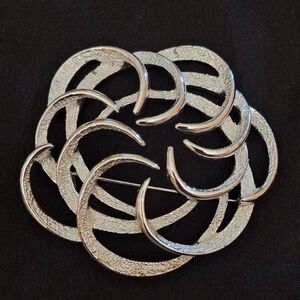 Vintage Sarah Coventry brooch, often recognized as the "Tailored Swirl" design f